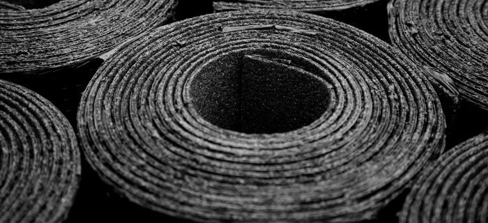 Rolls of black recycled rubber - GCP Industrial Products
